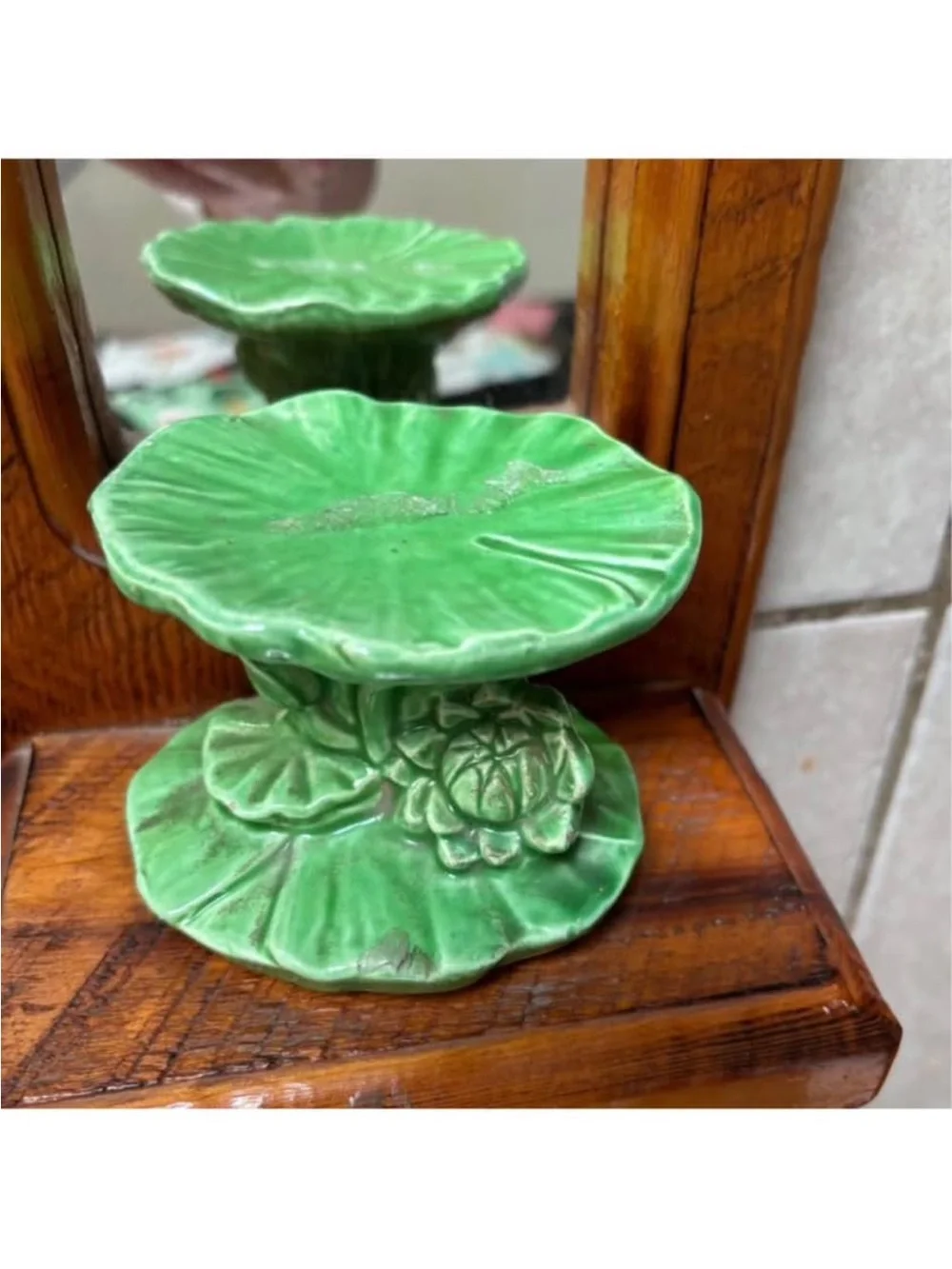 vintage wooden mirror sconce with a green ceramic candle holder